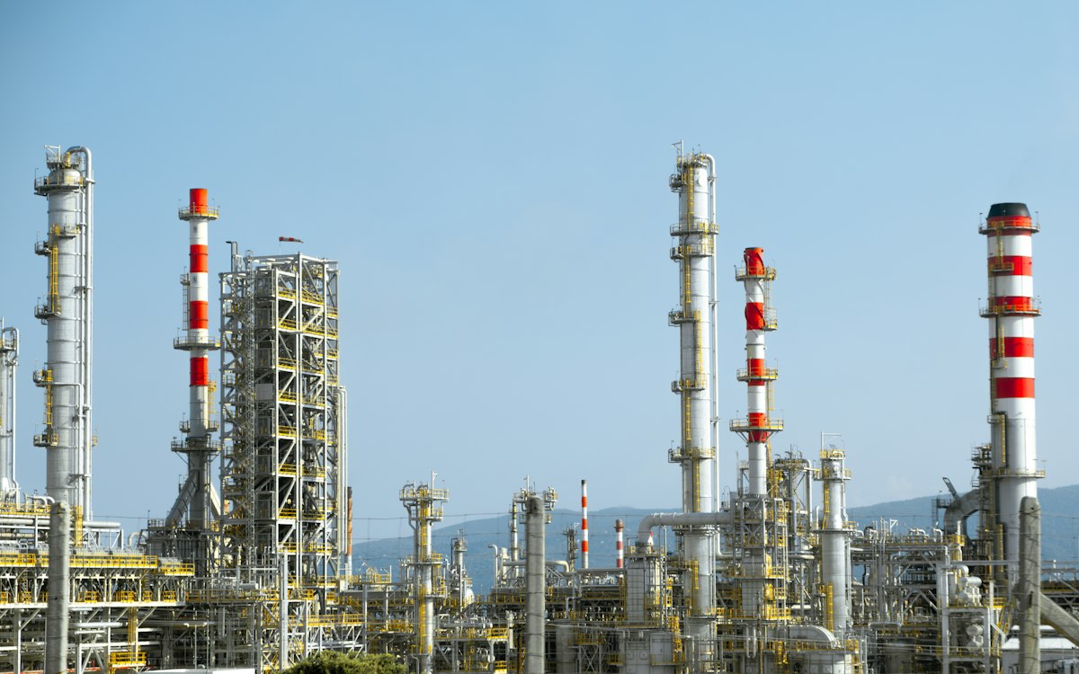 Refinery distillation columns and stacks under a clear sky